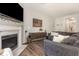 Cozy living room with fireplace, TV, and stylish decor at 420 Cherry St, Fuquay Varina, NC 27526