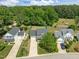 An aerial view showcases a neighborhood with neatly kept lawns and lush, mature trees at 4805 Ayden Mill Rd, Apex, NC 27539