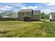 The backyard, which is large, features a well-maintained lawn and is adjacent to the screened-in porch at 4805 Ayden Mill Rd, Apex, NC 27539