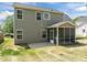 Charming home featuring a screened porch that opens to a beautiful backyard with a well-maintained lawn at 4805 Ayden Mill Rd, Apex, NC 27539