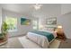 Cozy bedroom features natural light from two windows, plush carpet and neutral tones to promote relaxation at 4805 Ayden Mill Rd, Apex, NC 27539