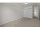 Bedroom features a double door closet and neutral carpet at 4805 Ayden Mill Rd, Apex, NC 27539