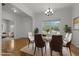 Dining room with hardwood floors, stylish decor, natural light and comfortable seating for an elegant entertaining experience at 4805 Ayden Mill Rd, Apex, NC 27539