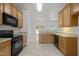 Well-equipped kitchen with ample cabinet space and modern lighting at 4805 Ayden Mill Rd, Apex, NC 27539