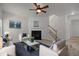 Bright living room featuring neutral colors, a fireplace, and a staircase at 4805 Ayden Mill Rd, Apex, NC 27539