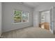 Bright office space features large windows and double French doors leading to another room at 4805 Ayden Mill Rd, Apex, NC 27539