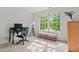 Bright room featuring a desk, chair, and large windows overlooking the landscape at 4900 American Dr, Durham, NC 27705