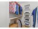 Walk-in closet with custom shelving, rod, and cubbies at 4900 American Dr, Durham, NC 27705