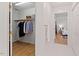 Walk-in closet with custom shelving and access to the primary bedroom and bath at 4900 American Dr, Durham, NC 27705