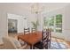 Bright dining room with hardwood floors, large windows, and views into the office at 4900 American Dr, Durham, NC 27705