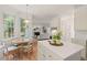 Open kitchen with island and an adjacent eat-in area, flowing seamlessly into the inviting living room at 4900 American Dr, Durham, NC 27705