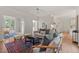 Spacious living room with an open floor plan, allowing for a seamless transition to the dining area and kitchen at 4900 American Dr, Durham, NC 27705