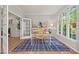 Well-lit home office featuring a desk, bookshelves, and large windows at 4900 American Dr, Durham, NC 27705