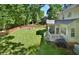 Spacious backyard with screened porch and grill area, ideal for outdoor activities at 5 Burgess Ct, Hillsborough, NC 27278