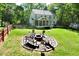 Large backyard with fire pit area, perfect for outdoor entertaining and relaxing at 5 Burgess Ct, Hillsborough, NC 27278