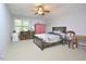 Spacious bedroom with a bed, dresser, and natural light from the window, offering a relaxing ambiance at 5 Burgess Ct, Hillsborough, NC 27278