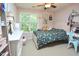 Cozy bedroom with light pink walls, a comfortable bed, a white dresser, and a window with natural light at 5 Burgess Ct, Hillsborough, NC 27278