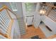 Bright foyer with hardwood floors, staircase, and a large window allowing natural light to flood the space at 5 Burgess Ct, Hillsborough, NC 27278