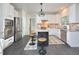 Modern kitchen with stainless steel appliances, granite countertops, and a central island at 5 Burgess Ct, Hillsborough, NC 27278