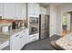 Bright kitchen features white cabinetry, stainless steel appliances, and granite counters at 5 Burgess Ct, Hillsborough, NC 27278