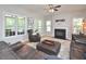 Spacious living room with a fireplace, plush seating, and plenty of natural light at 5 Burgess Ct, Hillsborough, NC 27278