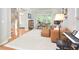 Bright living room features hardwood floors and a cozy seating area with natural light at 5 Burgess Ct, Hillsborough, NC 27278