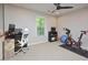 Comfortable office with neutral walls, large windows, ceiling fan, and space for both work and exercise at 5 Burgess Ct, Hillsborough, NC 27278