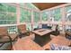 Inviting sunroom with comfortable seating and views of the outdoor landscape at 5 Burgess Ct, Hillsborough, NC 27278