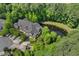 Aerial view of townhomes nestled within a densely wooded area, providing a peaceful and private environment at 51 Abernathy Dr, Chapel Hill, NC 27517