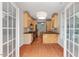 Charming kitchen featuring wood cabinets, black countertops, and hardwood floors at 51 Abernathy Dr, Chapel Hill, NC 27517