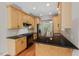 Kitchen featuring black granite countertops, wooden cabinets, and stainless steel appliances at 51 Abernathy Dr, Chapel Hill, NC 27517