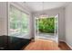 Bright living room featuring hardwood floors and French doors leading to an outdoor patio at 51 Abernathy Dr, Chapel Hill, NC 27517
