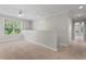 Spacious carpeted loft area with a ceiling fan and ample natural light at 51 Abernathy Dr, Chapel Hill, NC 27517
