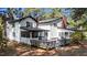 Expansive backyard with a patio, screened porch, and deck offers plenty of outdoor space at 512 Stratford Dr, Zebulon, NC 27597