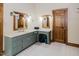 Bathroom with vanity, dual mirrors, and stylish cabinets at 512 Stratford Dr, Zebulon, NC 27597