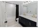 This bathroom features a vanity with double sinks, shower-tub and fixtures at 512 Stratford Dr, Zebulon, NC 27597