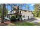 View of the back of the home with a balcony and three-car garage at 512 Stratford Dr, Zebulon, NC 27597