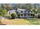 Charming two-story home featuring a front porch with black shutters and landscaping at 512 Stratford Dr, Zebulon, NC 27597