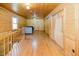 Hallway features wood flooring and a view of the living room at 512 Stratford Dr, Zebulon, NC 27597