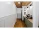 Kitchen featuring stainless steel appliances, green cabinets, wooden ceiling, and wine rack at 512 Stratford Dr, Zebulon, NC 27597