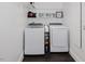 Functional laundry room with shelving, modern washer and dryer, and neutral decor at 512 Stratford Dr, Zebulon, NC 27597
