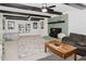 Open-concept living room with fireplace, sofa, and view of built-in shelving at 512 Stratford Dr, Zebulon, NC 27597