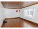 Spacious living room with hardwood floors, wood-paneled ceiling, bright windows, and ample natural light at 512 Stratford Dr, Zebulon, NC 27597