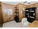 Cozy office features wood paneling, floating shelves and built-in shelving at 512 Stratford Dr, Zebulon, NC 27597
