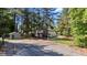 Tennis court view with a charming outbuilding, all enclosed within a fenced yard at 512 Stratford Dr, Zebulon, NC 27597