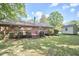 The backyard features a deck, a shed, and plenty of space for activities and relaxation at 5319 Memory Ln, Durham, NC 27712
