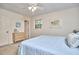 Cozy bedroom with a comfortable bed, neutral walls, and natural light filtering through the window at 5319 Memory Ln, Durham, NC 27712