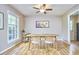 Bright dining room with hardwood floors, contemporary table and chairs, and natural light at 5319 Memory Ln, Durham, NC 27712