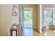 Bright entryway featuring hardwood floors, a console table, and a view of the outdoors at 5319 Memory Ln, Durham, NC 27712