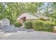 The exterior shows the home is in a wooded area with extra storage available in the shed at 5319 Memory Ln, Durham, NC 27712